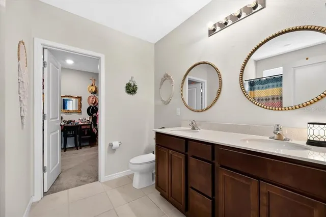 a bathroom with a double vanity sink and a mirror
