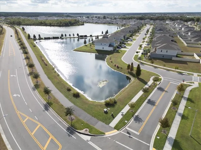 an aerial view of a house with a swimming pool