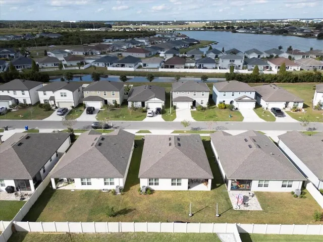 an aerial view of a house with lake view