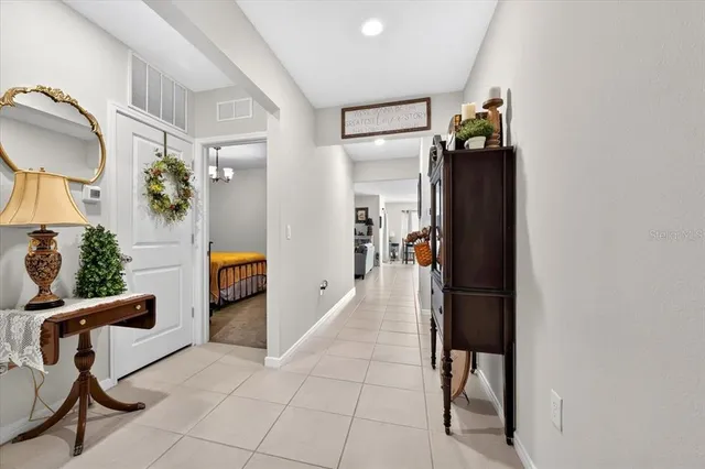 a view of a hallway and dining room