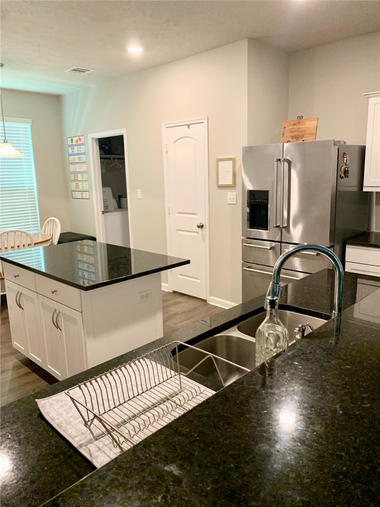 2019 Jester Trail Bryan, TX 77807 - Photo 5 of 25 a kitchen with sink and refrigerator
