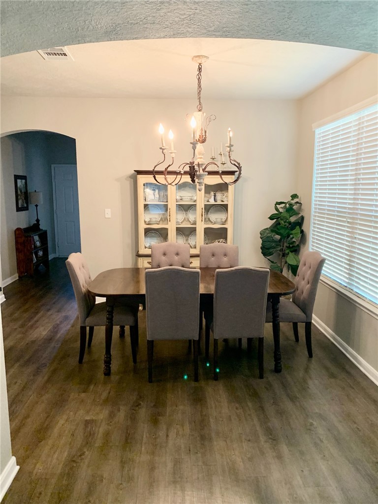 2019 Jester Trail Bryan, TX 77807 - Photo 10 of 25 a view of a dining room with furniture and wooden floor