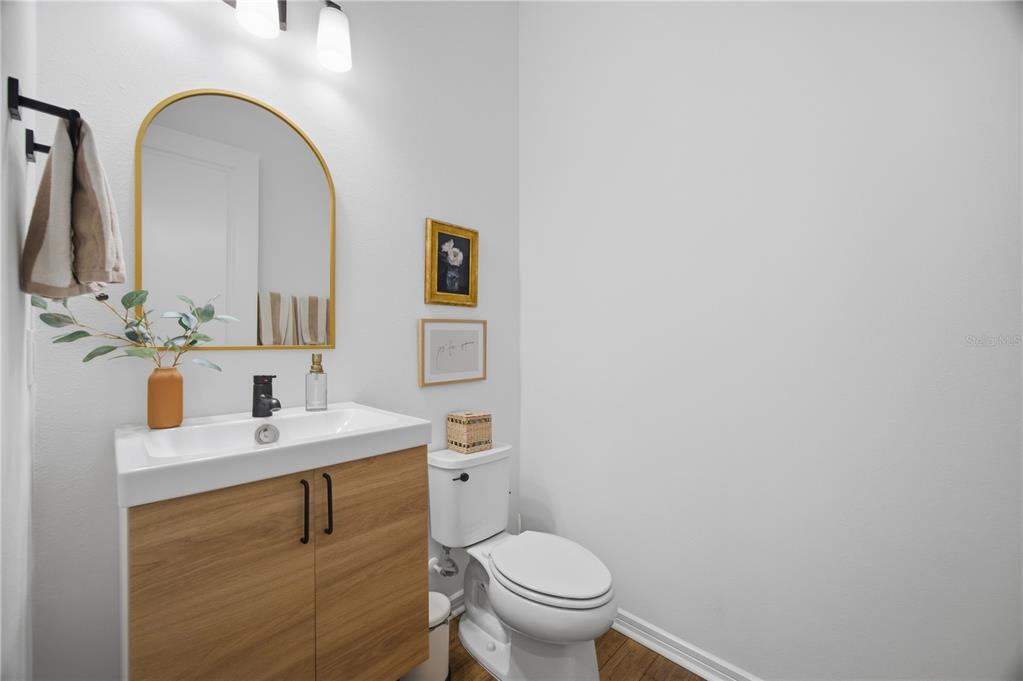13816 Sharp Hawk Drive Riverview, FL 33569 - Photo 26 of 76 a bathroom with a toilet sink and mirror