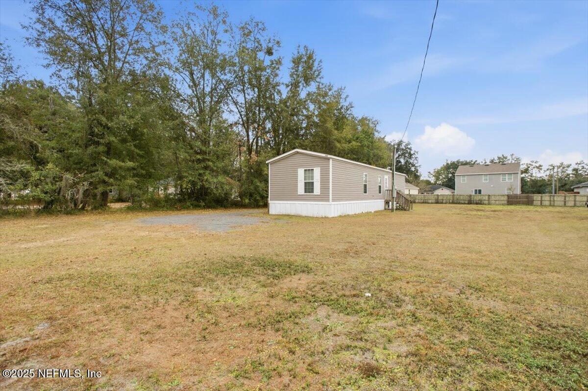 524 West Railroad Avenue Macclenny, FL 32063 - Photo 10 of 11 a view of a house with a yard