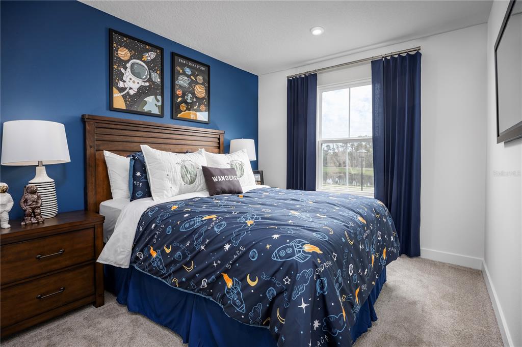 562 Creedmore Lane DeBary, FL 32713 - Photo 13 of 17 a bedroom with a bed and wooden floor