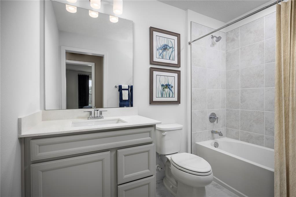 562 Creedmore Lane DeBary, FL 32713 - Photo 15 of 17 a bathroom with a sink a toilet and shower