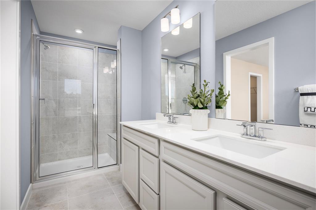 562 Creedmore Lane DeBary, FL 32713 - Photo 16 of 17 a bathroom with a shower sink and mirror