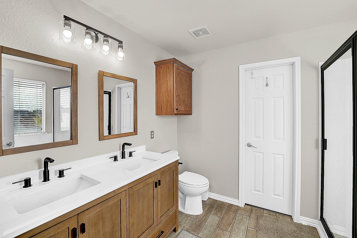 113 Endeavour Kyle, TX 78640 - Photo 20 of 38 Updated primary ensuite with dual vanity and door to walk-in closet