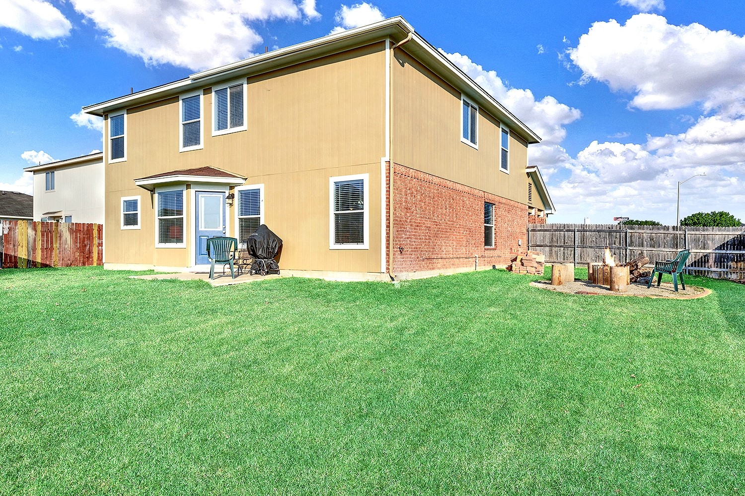 113 Endeavour Kyle, TX 78640 - Photo 32 of 38 Side yard with view of firepit. Grass color enhanced