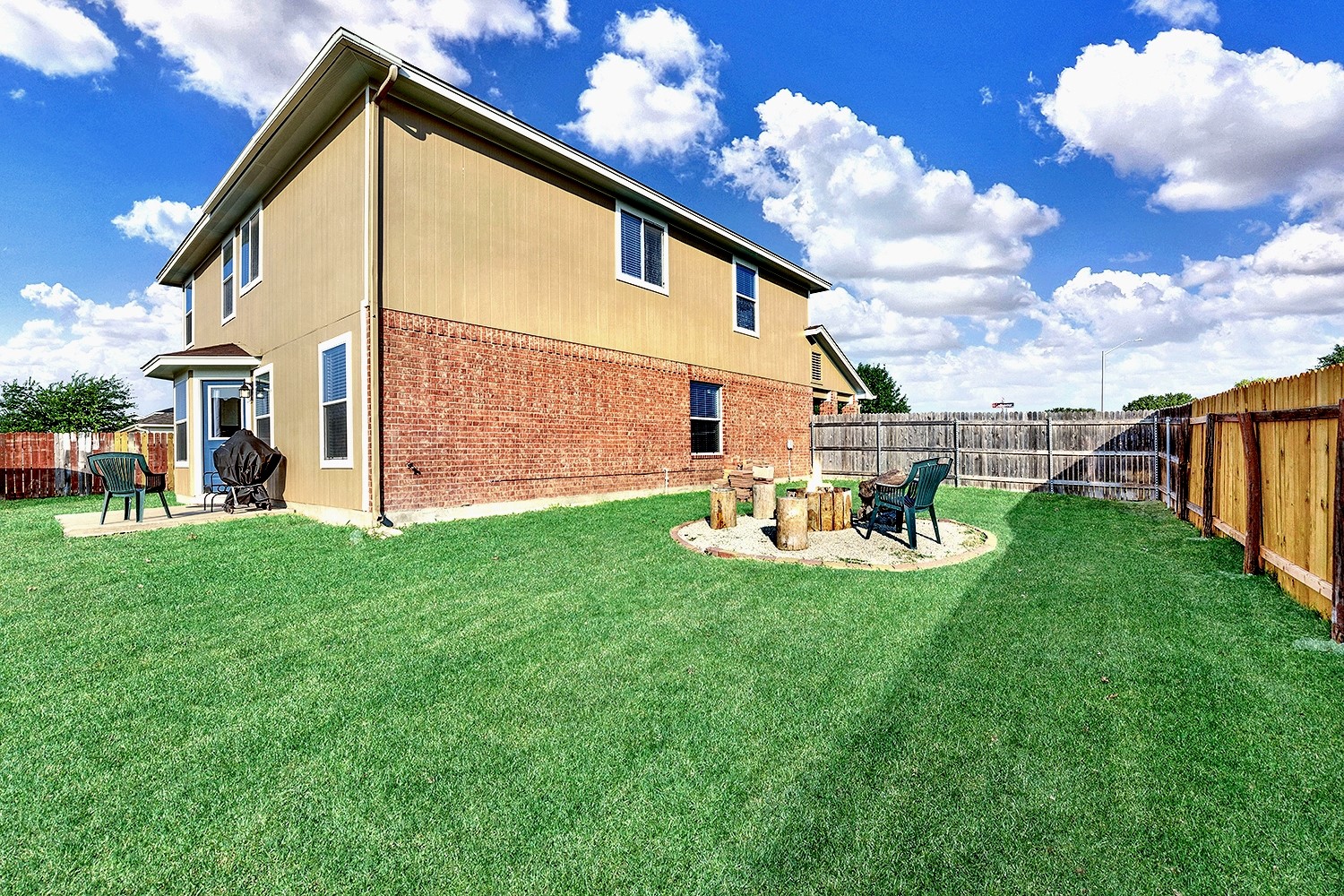 113 Endeavour Kyle, TX 78640 - Photo 33 of 38 Side yard with view of firepit. Grass color enhanced