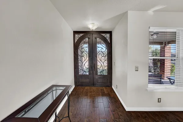 a living room with furniture window and wooden floor