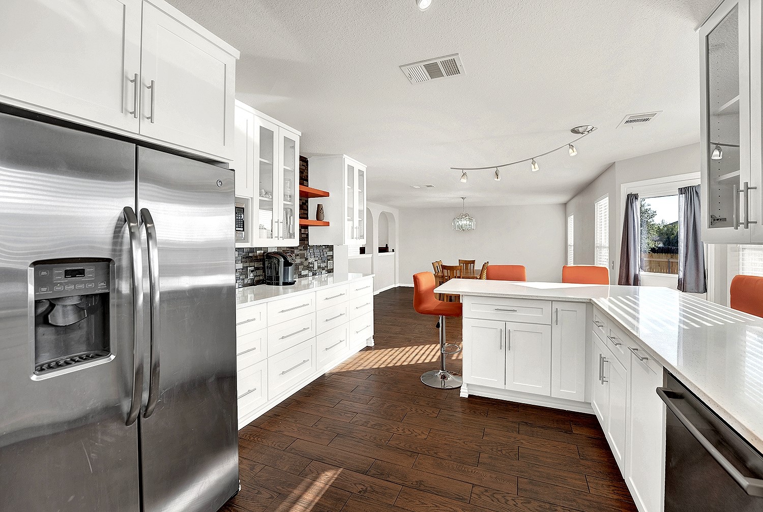 113 Endeavour Kyle, TX 78640 - Photo 10 of 38 Kitchen with upgrades throughout; track lighting, quartz countertops, stainless steel appliances