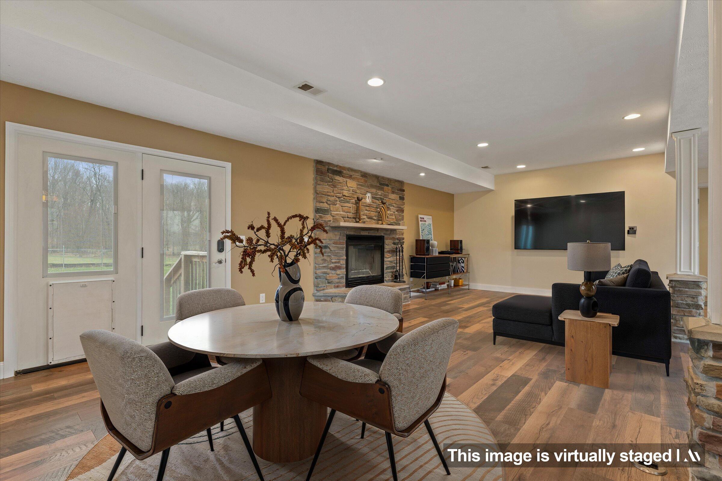 7692 North Emery Road Rolling Prairie, IN 46371 - Photo 11 of 69 a view of a dining room with furniture