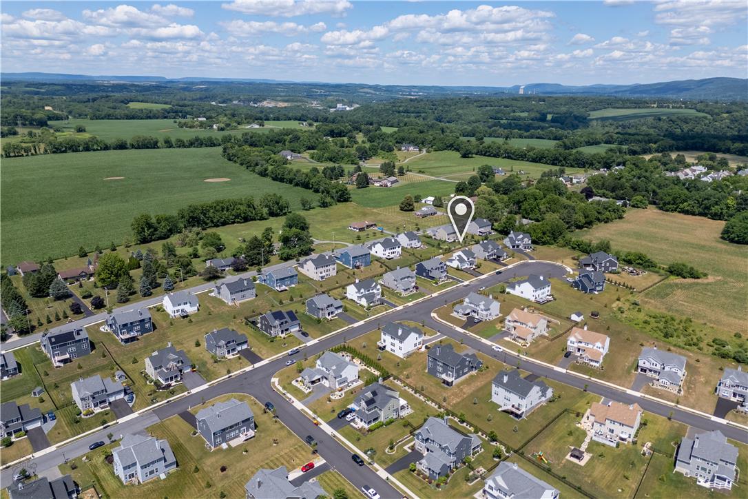 640 Rinaldi Lane Easton, PA 18040 - Photo 38 of 42 An aerial perspective reveals a thriving residential community nestled against verdant farmlands and distant hills.