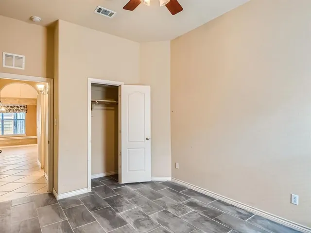 a bathroom with a sink vanity mirror and toilet