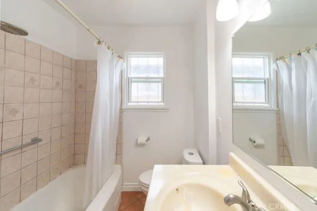 a bathroom with a bathtub and sink