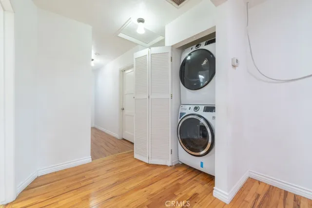 a view of a storage and utility room with washer and dryer