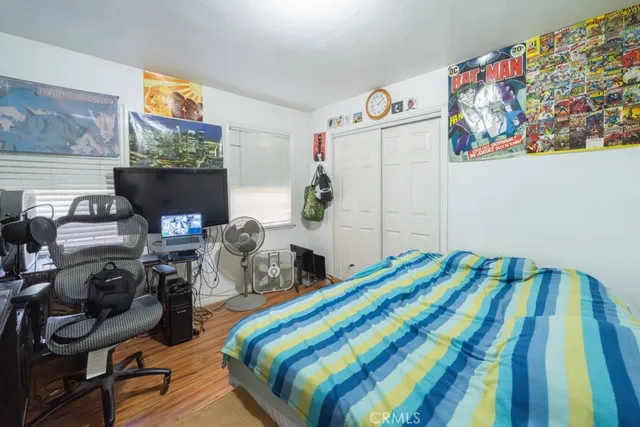 a bedroom with a bed and a tv in it