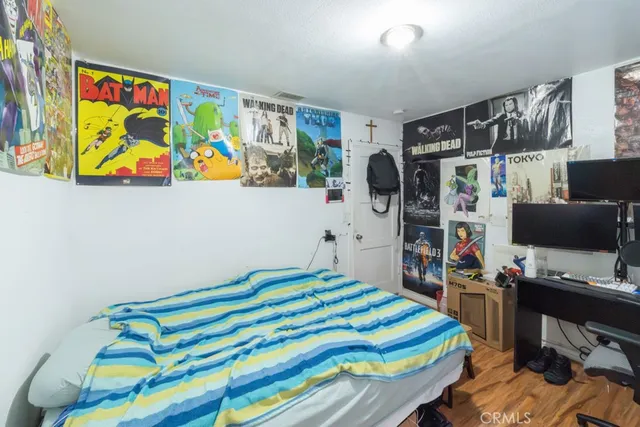 a bedroom with a bed and a bookshelf