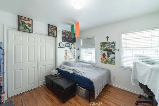 a bedroom with bed and a window