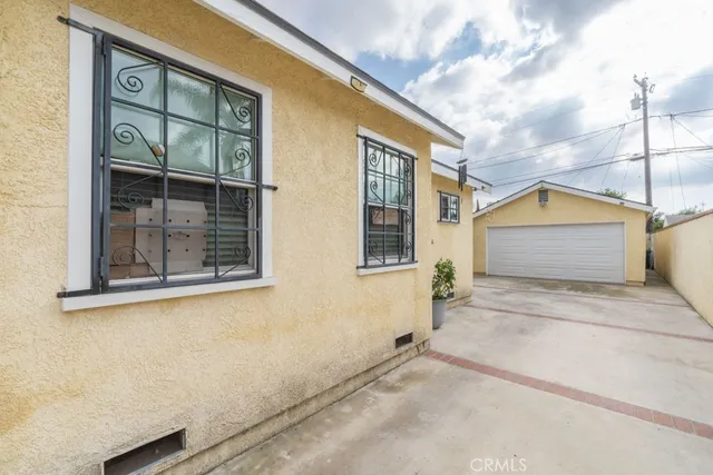 a view of a house with a window and brick walls
