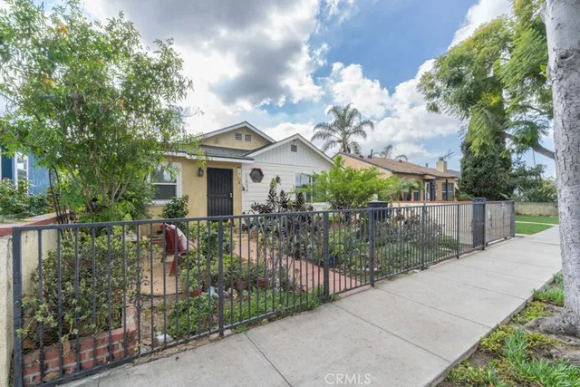 a view of house with a garden