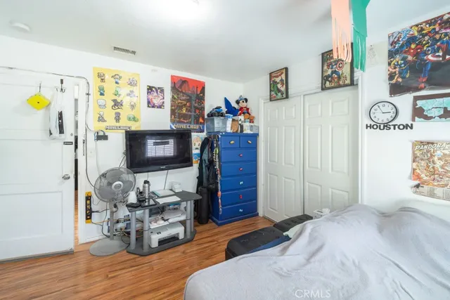 a bedroom with furniture and a bed