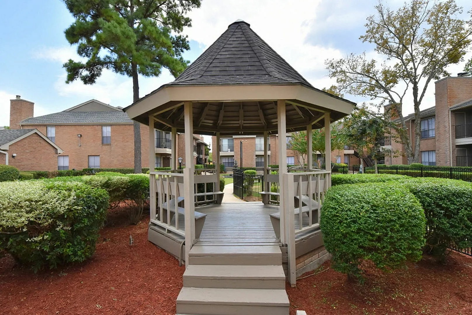 1230 Farm To Market 1960 Bypass Road East, Unit 903 Humble, TX 77338 - Photo 6 of 20 a view of a house with yard and sitting area