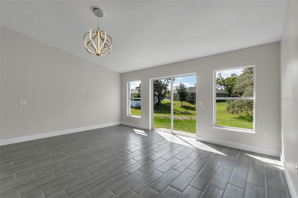 506 Peace Way Kissimmee, FL 34759 - Photo 17 of 34 a view of an empty room with a window