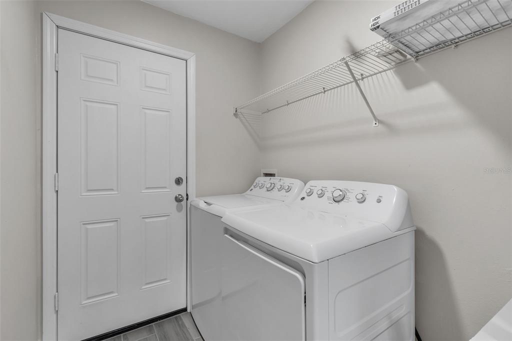 506 Peace Way Kissimmee, FL 34759 - Photo 24 of 34 a utility room with dryer and washer