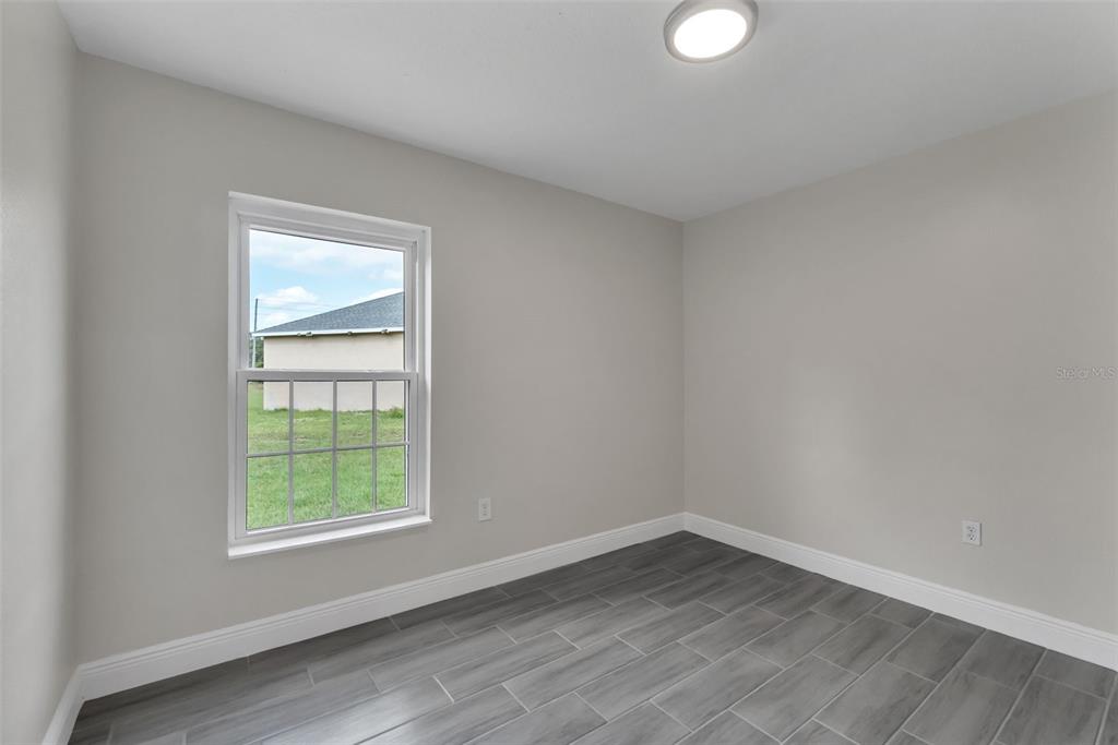 506 Peace Way Kissimmee, FL 34759 - Photo 29 of 34 an empty room with a window