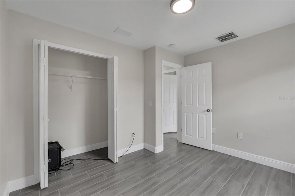 506 Peace Way Kissimmee, FL 34759 - Photo 30 of 34 a view of empty room with wooden floor
