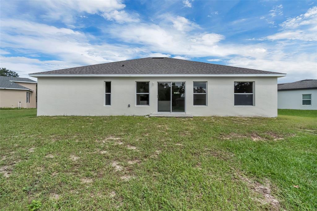 506 Peace Way Kissimmee, FL 34759 - Photo 32 of 34 front view of a house with a yard