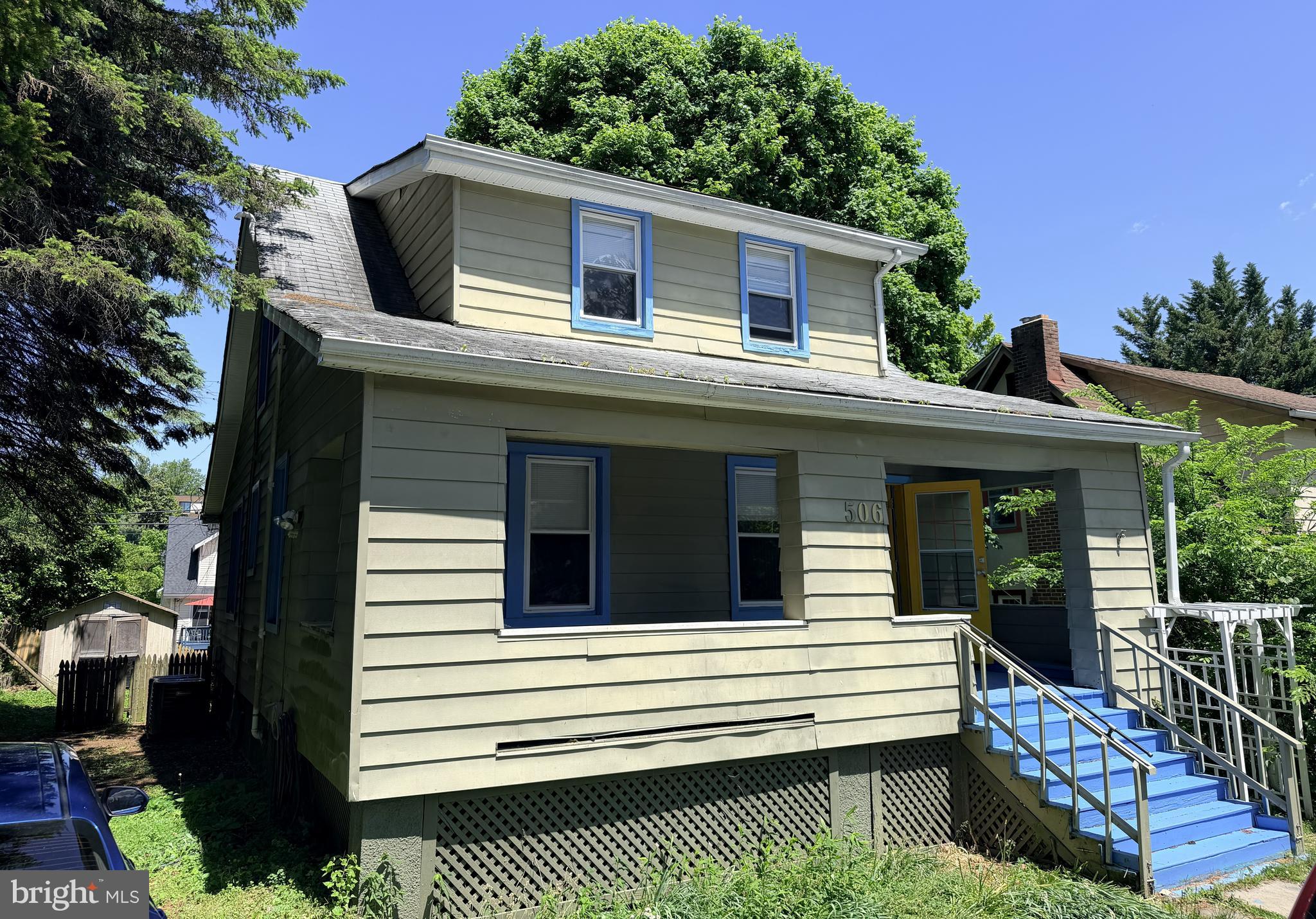 a view of a house with a balcony and wooden floor