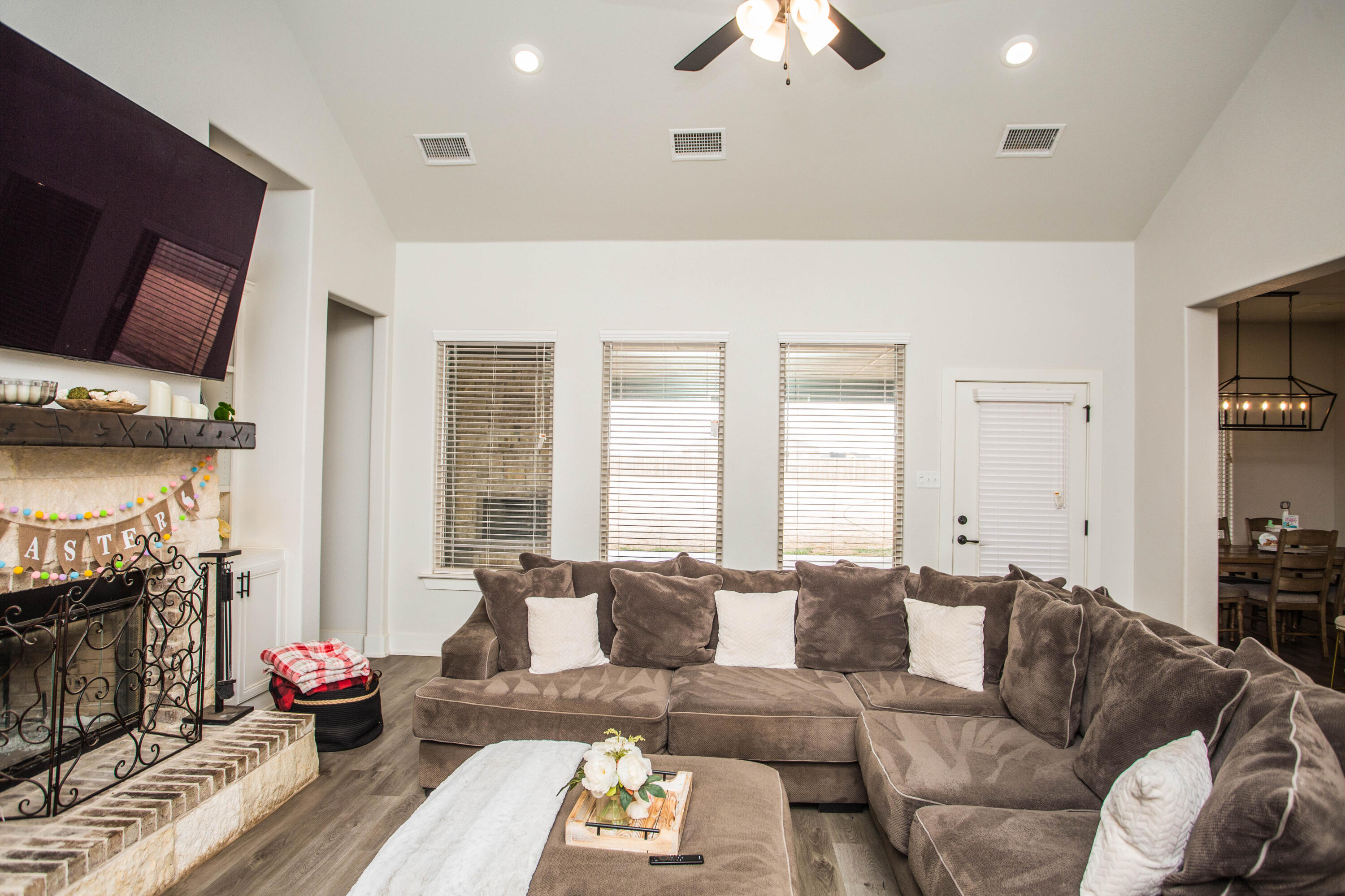 2204 County Road 7815 Lubbock, TX 79423 - Photo 14 of 58 a living room with furniture and a fireplace