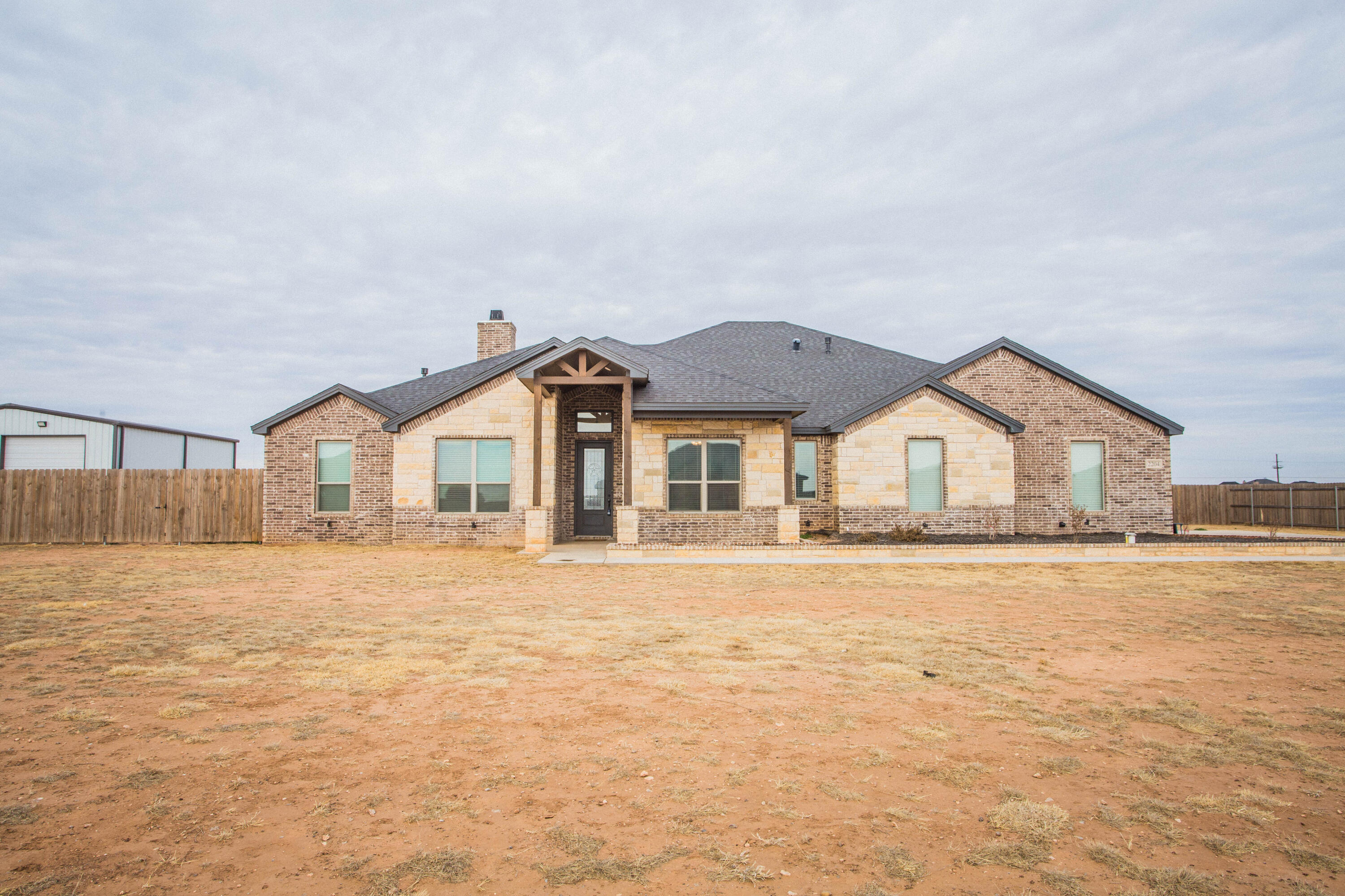 2204 County Road 7815 Lubbock, TX 79423 - Photo 2 of 58 a front view of house with yard and green space