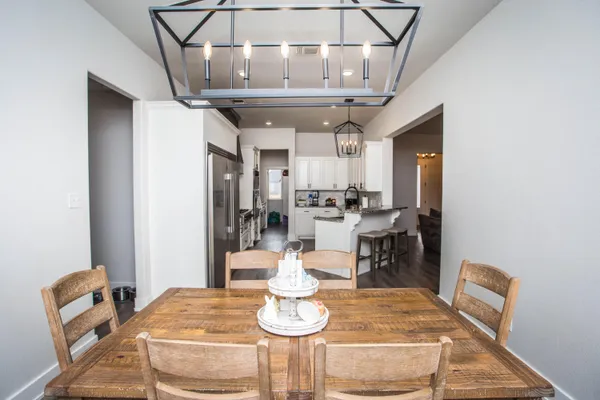 a kitchen with granite countertop lots of counter top space and wooden floor