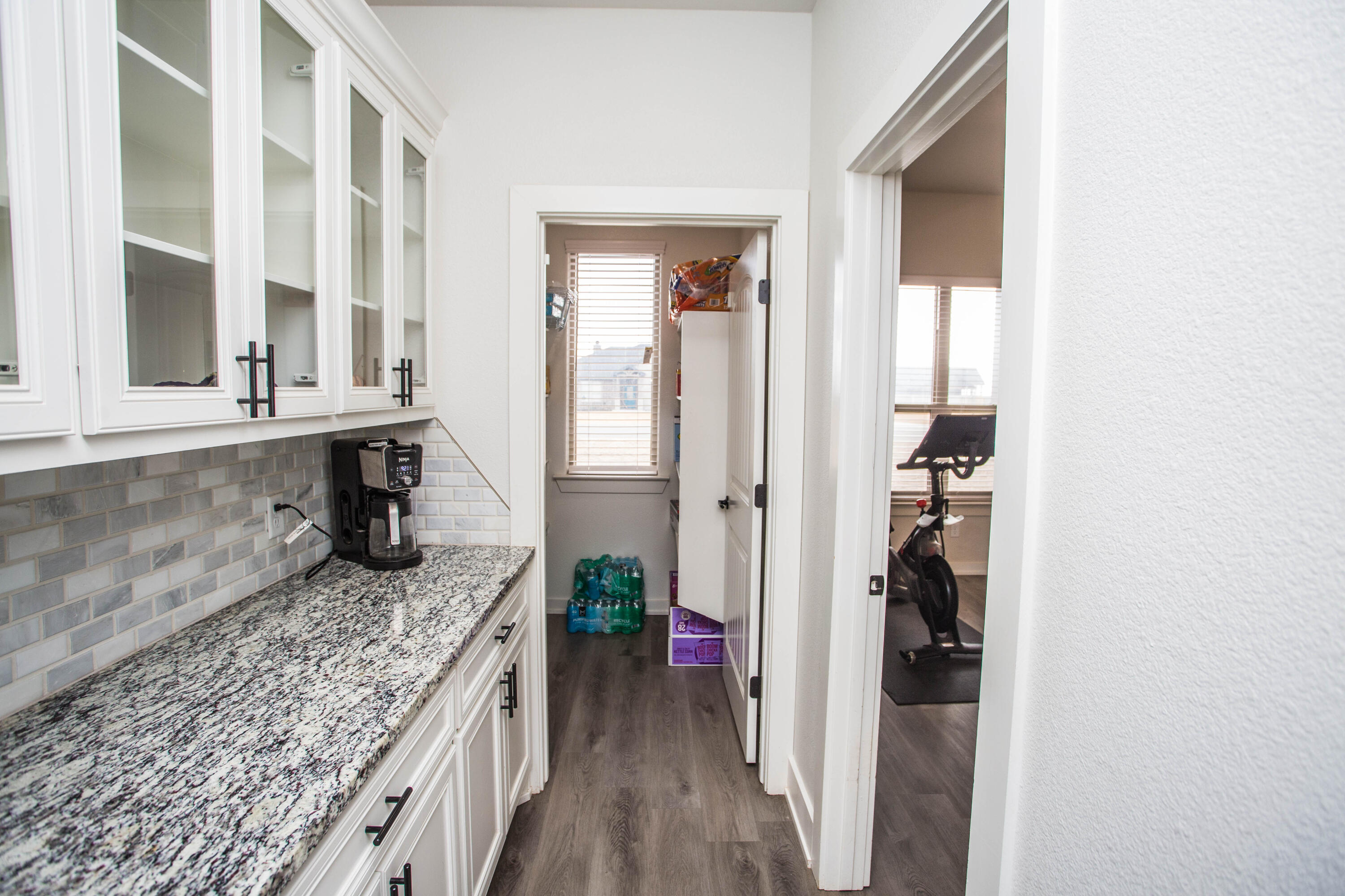 2204 County Road 7815 Lubbock, TX 79423 - Photo 26 of 58 a kitchen with granite countertop a sink and a stove