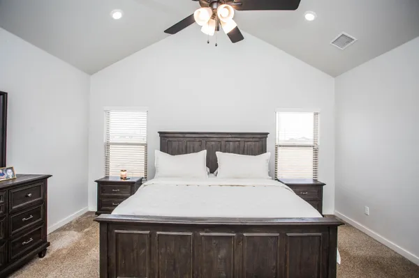 a bedroom with a bed and window