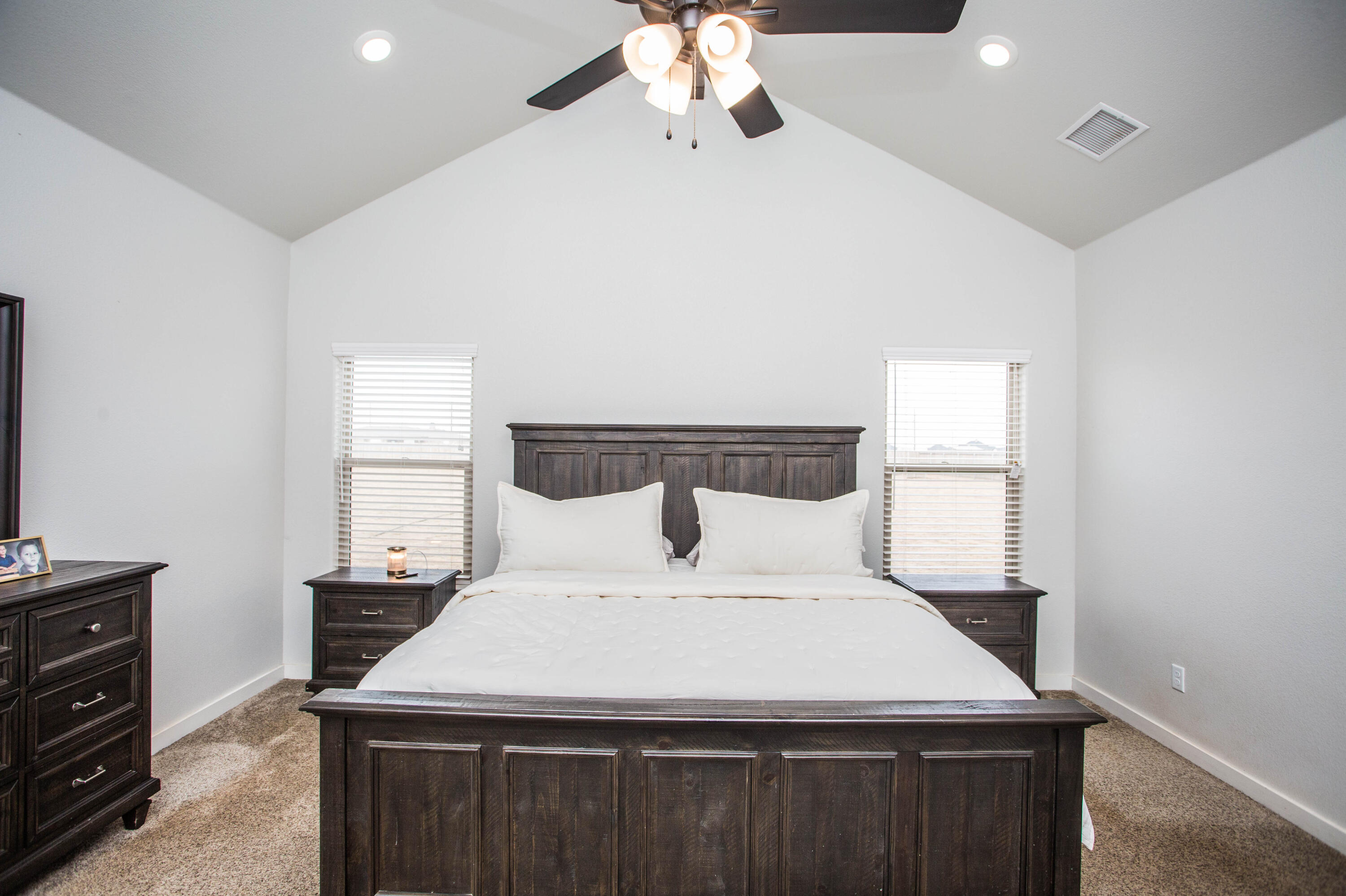 2204 County Road 7815 Lubbock, TX 79423 - Photo 28 of 58 a large white bed in a white room