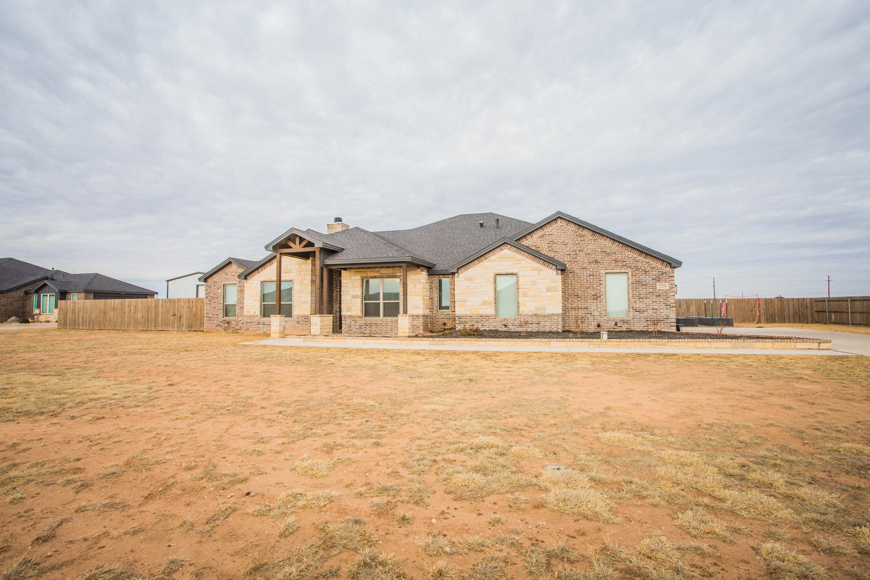 2204 County Road 7815 Lubbock, TX 79423 - Photo 3 of 58 a view of house with yard and swimming pool