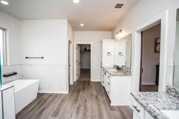 a white bath tub sitting in a bathroom