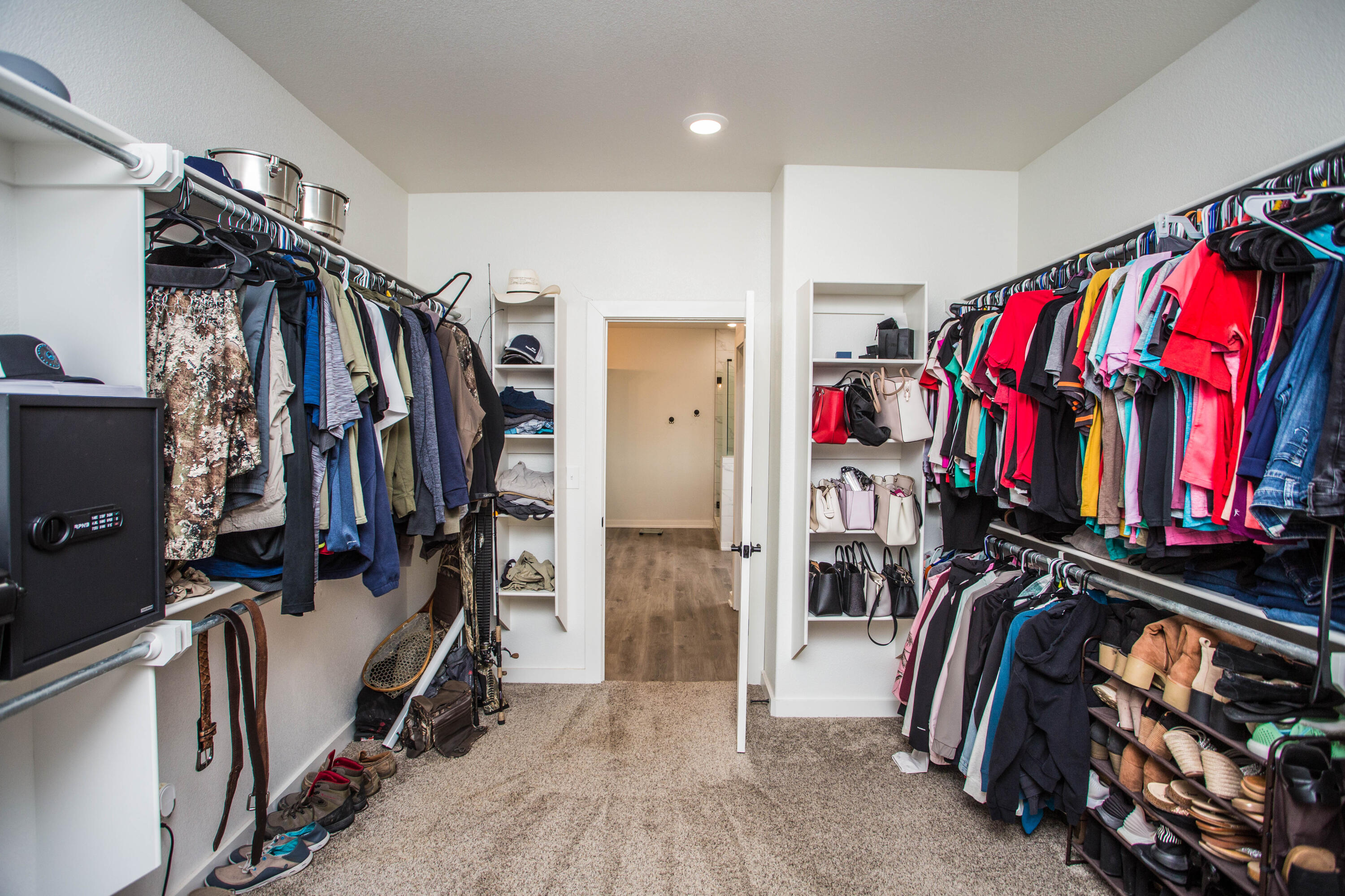 2204 County Road 7815 Lubbock, TX 79423 - Photo 37 of 58 a view of walk in closet with clothes