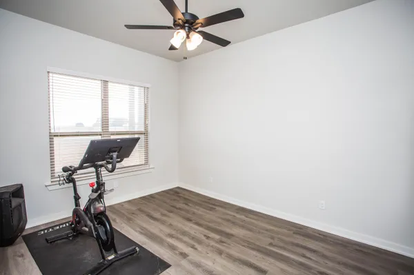 a bedroom with a bed and a flat tv screen