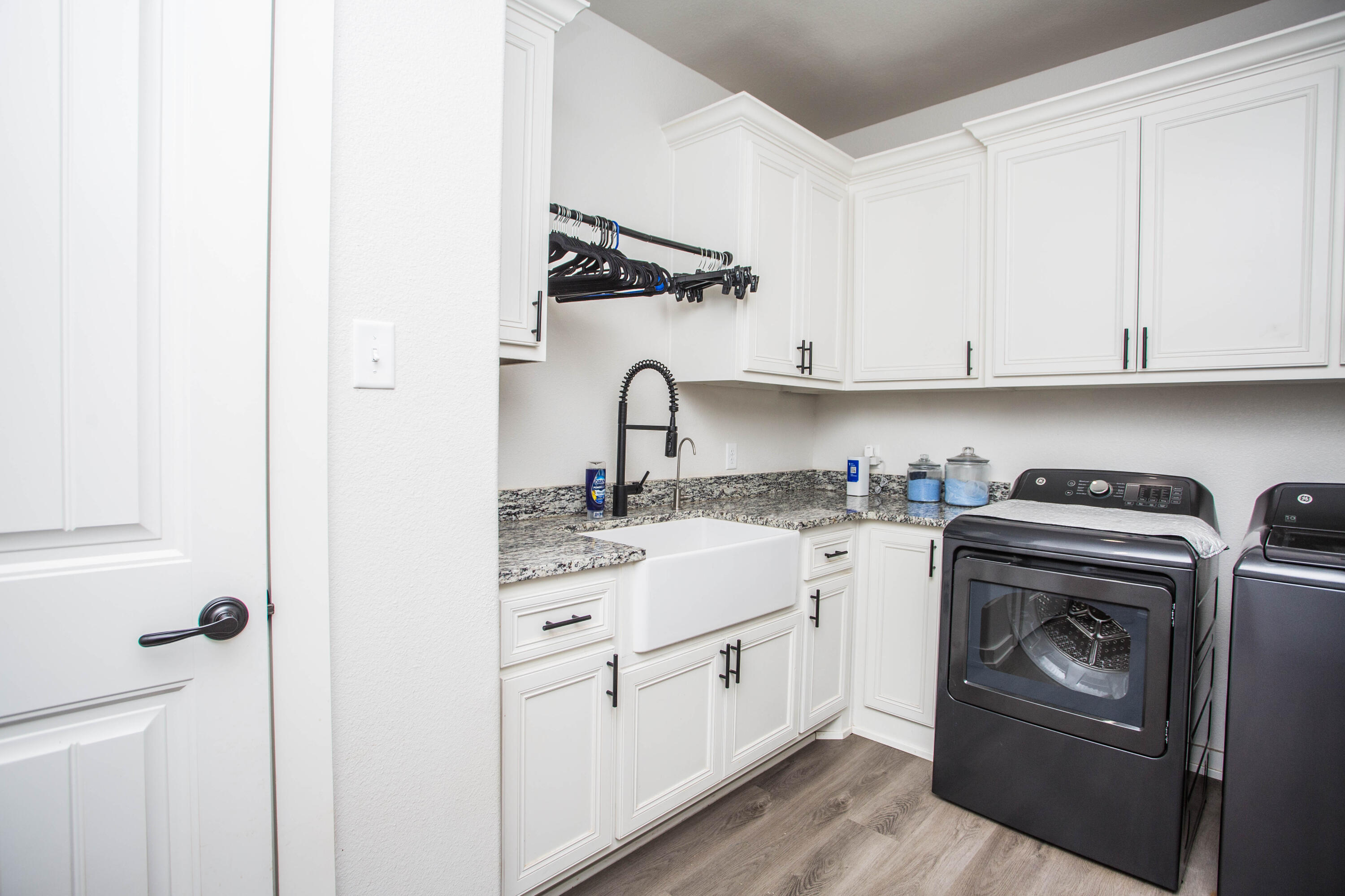 2204 County Road 7815 Lubbock, TX 79423 - Photo 50 of 58 a kitchen with a stove top oven sink and cabinets