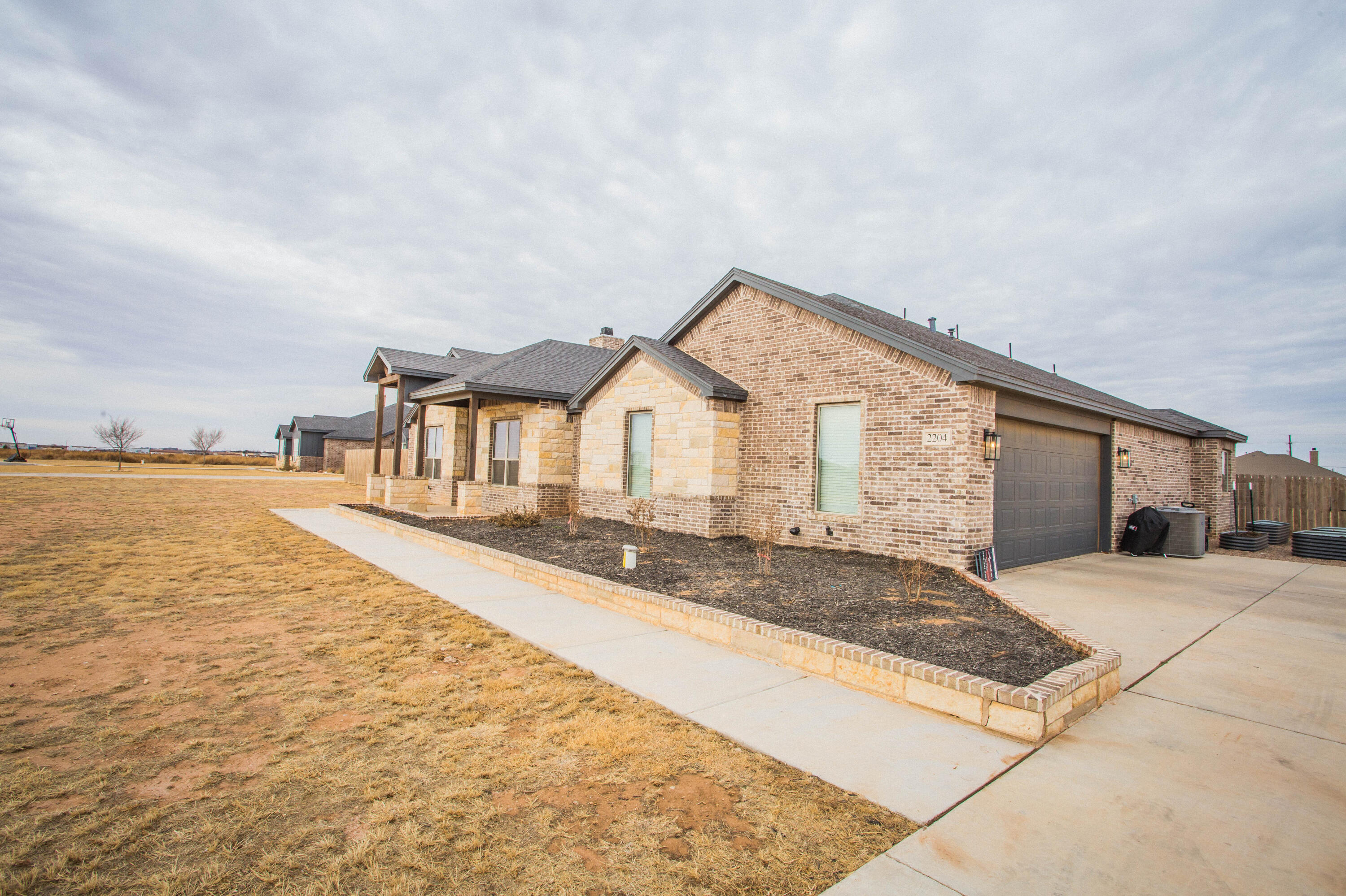 2204 County Road 7815 Lubbock, TX 79423 - Photo 5 of 58 a view of a house with swimming pool and sitting area