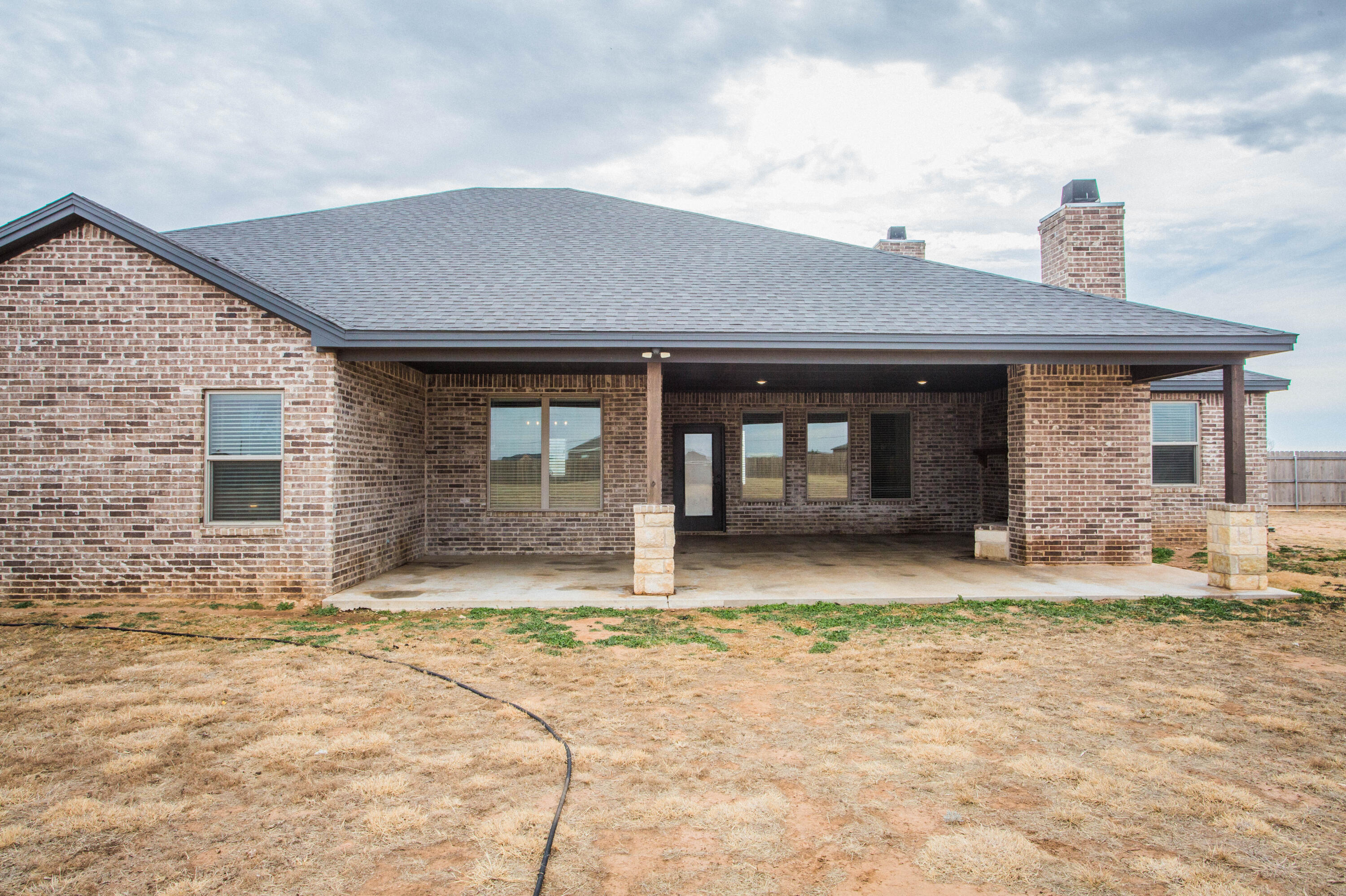 2204 County Road 7815 Lubbock, TX 79423 - Photo 56 of 58 a front view of a house with a yard