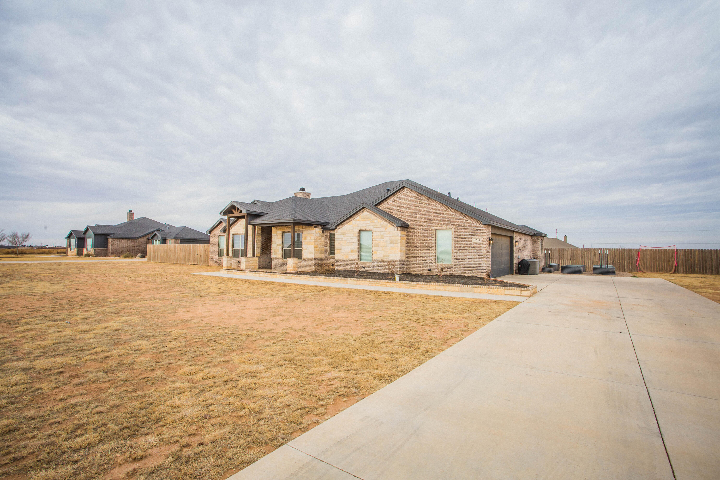 2204 County Road 7815 Lubbock, TX 79423 - Photo 6 of 58 a front view of house with yard and ocean view