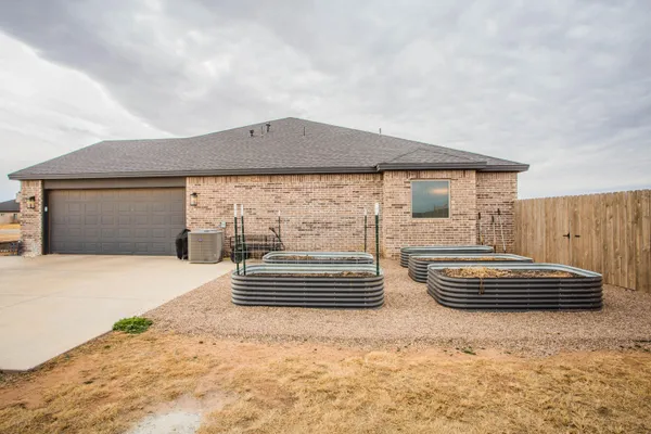 a front view of a house with yard
