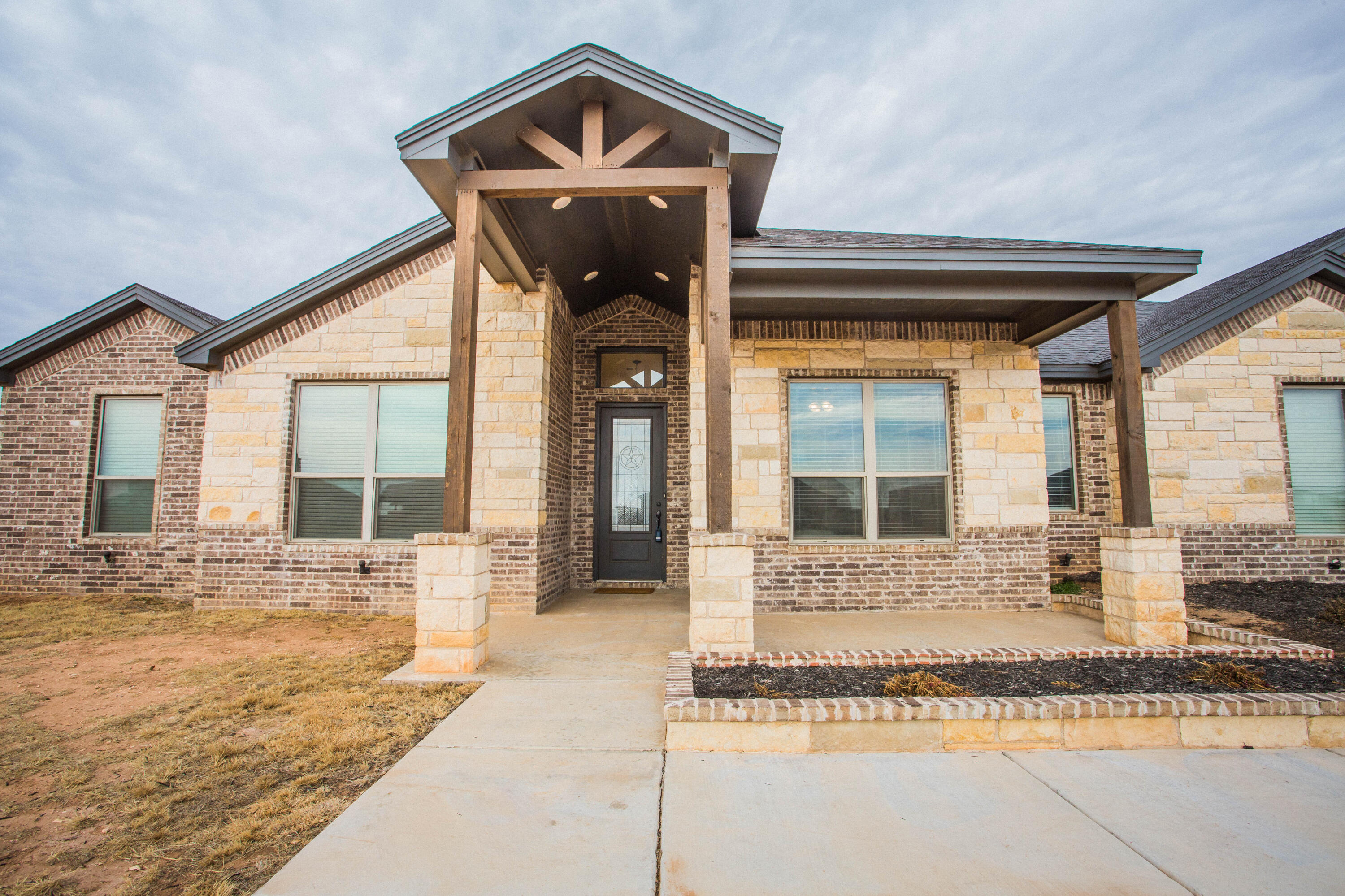 2204 County Road 7815 Lubbock, TX 79423 - Photo 8 of 58 a front view of a house with yard